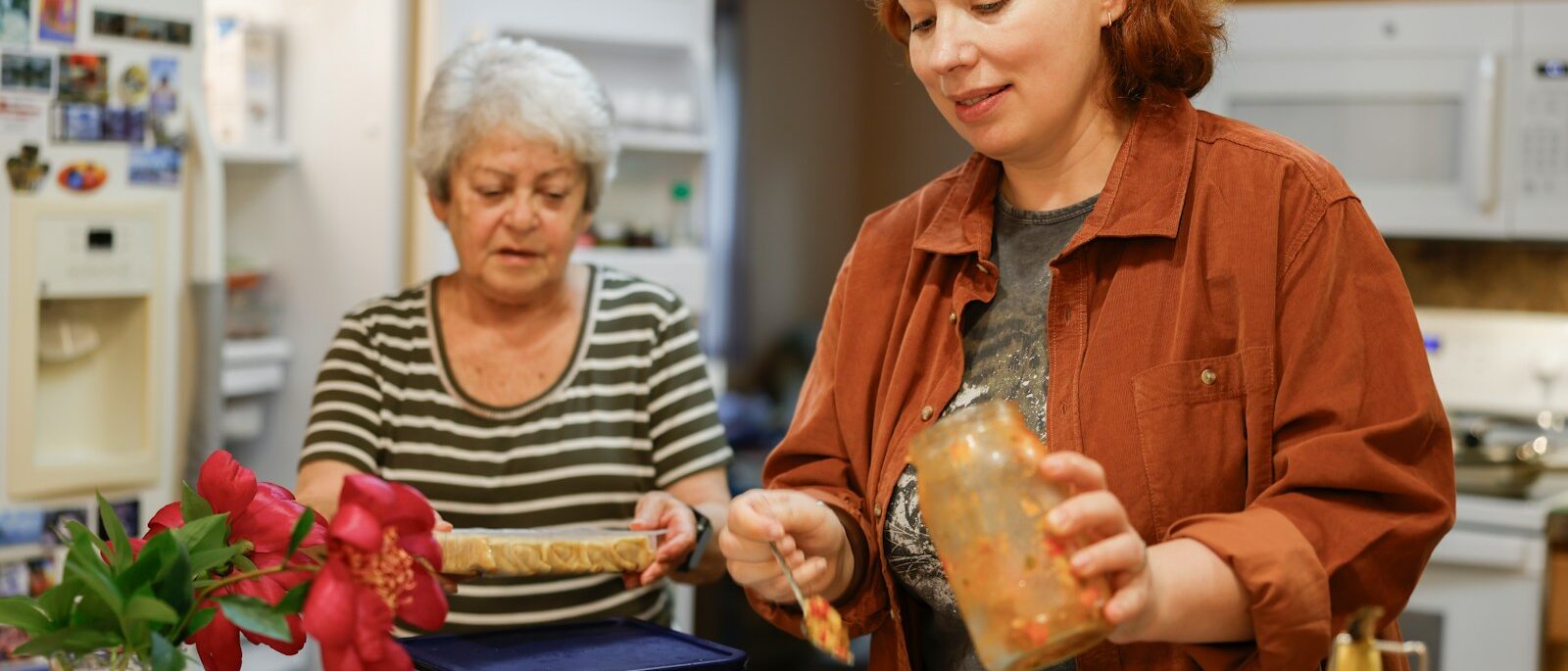 Two women preparing food in a kitchen, reflecting on being a narcissist